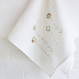 EMBROIDERED LINEN TEA TOWEL - daisies