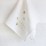 EMBROIDERED LINEN TEA TOWEL - daisies